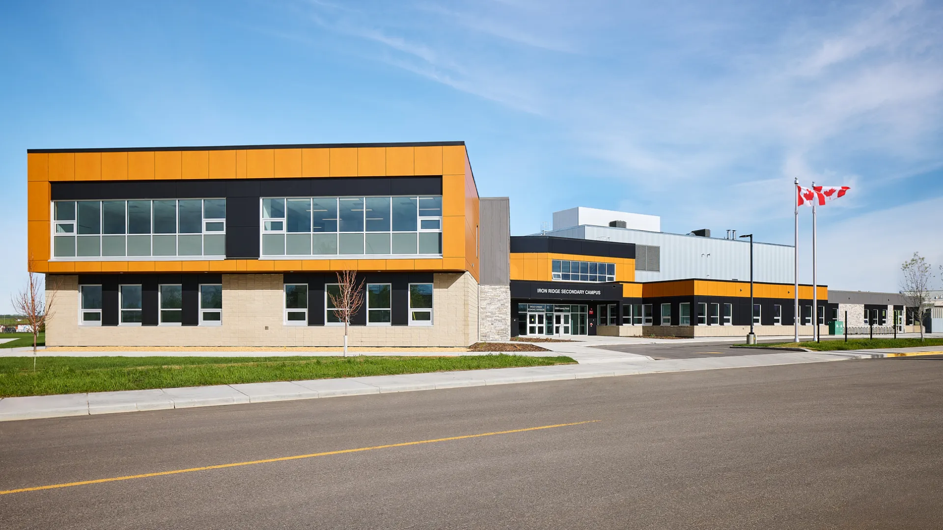 Cropped - Alberta high school with flags